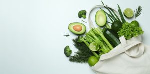 cotton-bag-with-green-vegetables-on-white-backgrou-2021-05-04-21-09-17-utc.jpg